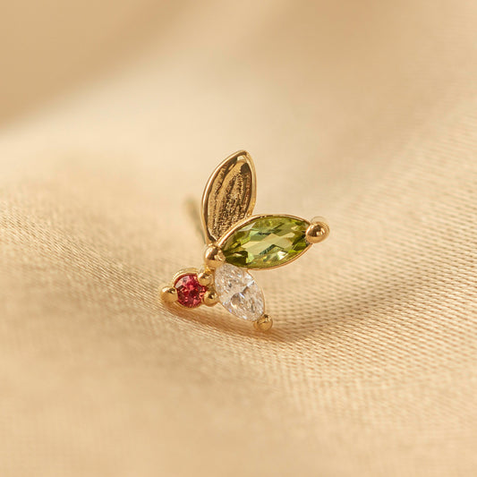 This holiday edition of our original Monet's Lily Petals Earrings is adorned with a brushstroke-textured gold leaf, an apple-green tourmaline, and a brilliant-cut white diamond. At its heart, a scarlet-red sapphire emulates the vibrant berry of the mistletoe. A delicate yet striking statement piece, perfect for the season!

mini canvas, artist's canvas, paintings, painter, tourmaline, sapphire, earrings, studs, dainty jewelry, brushstroke texture