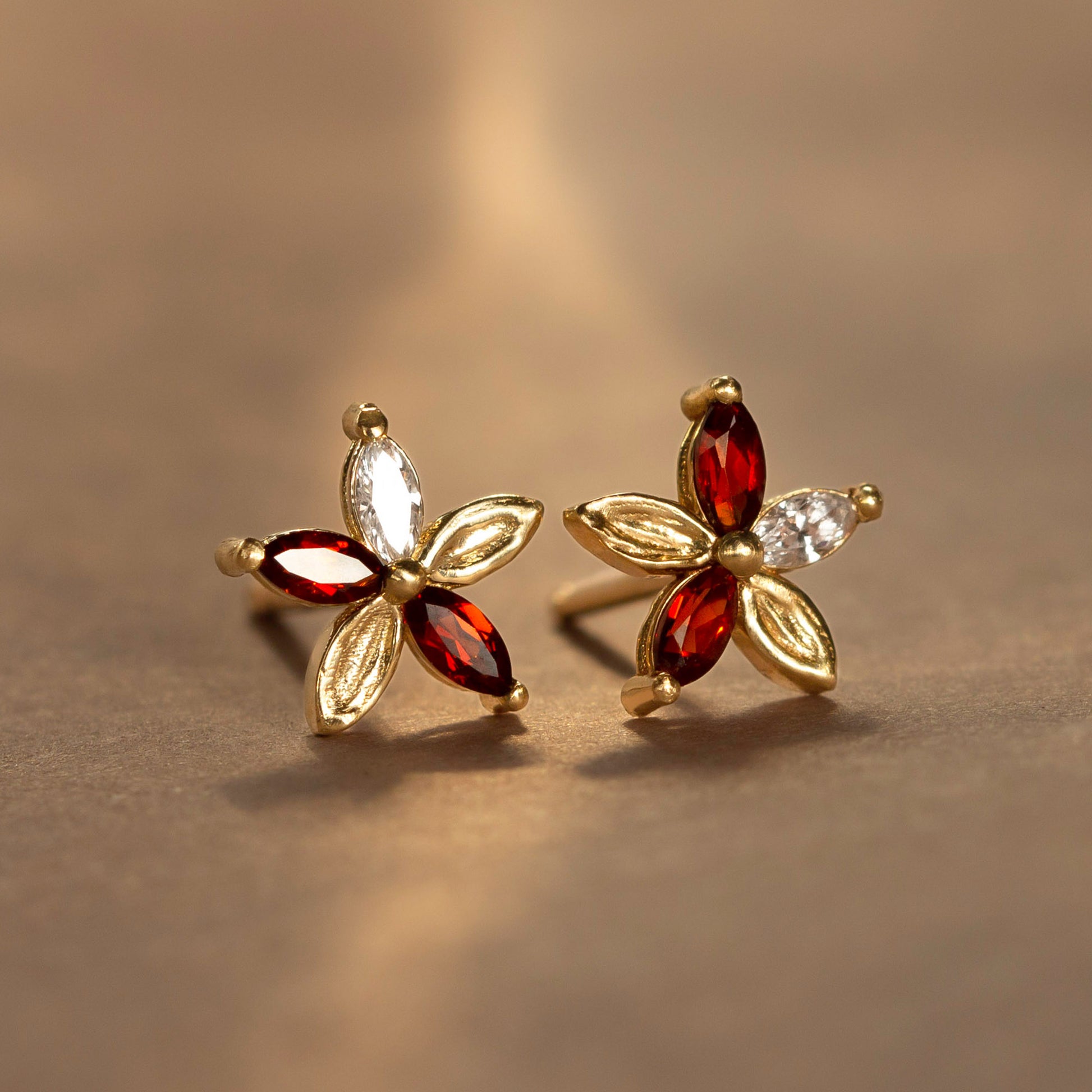 Monet’s Poinsettia, a reinterpretation of our Monet’s Lily Earrings, has been reimagined with deep cranberry-red marquise garnets while retaining the gracefully pressed brushstroke textures. Perfect for a more romantic holiday look, wear them throughout the season for a subtle statement in full bloom.