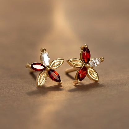 Monet’s Poinsettia, a reinterpretation of our Monet’s Lily Earrings, has been reimagined with deep cranberry-red marquise garnets while retaining the gracefully pressed brushstroke textures. Perfect for a more romantic holiday look, wear them throughout the season for a subtle statement in full bloom.